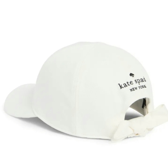 kate spade white baseball cap with gold and pink spade charm